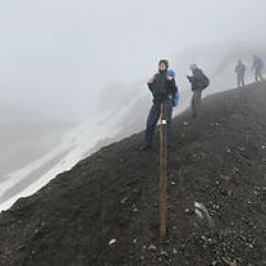 a person walking down a dirt road