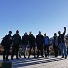 a group of people standing in front of a crowd