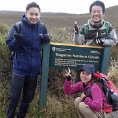 a group of people standing in the dirt