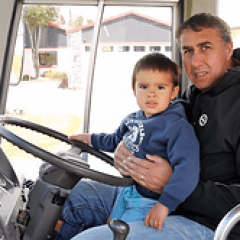 a small child sitting on a motorcycle