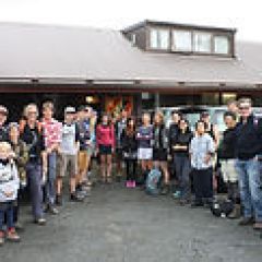 a group of people standing in front of a building